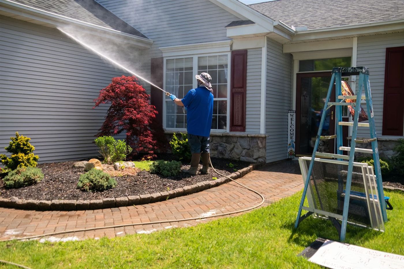 Exterior house wall being washed